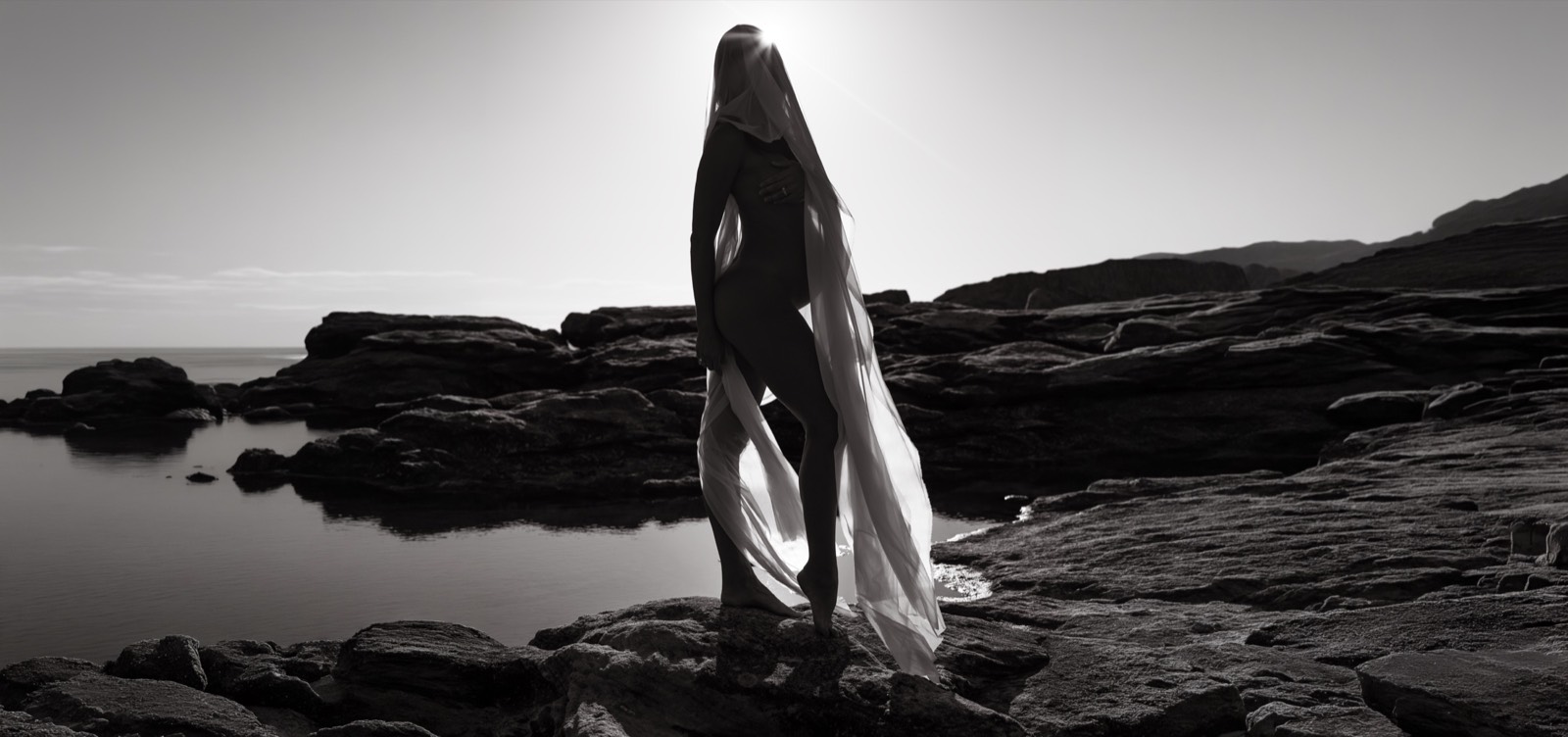 Sculptural coastal maternity portrait