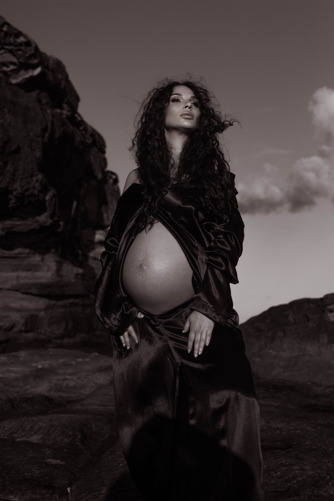 Editorial black and white maternity portrait in fluid tailoring