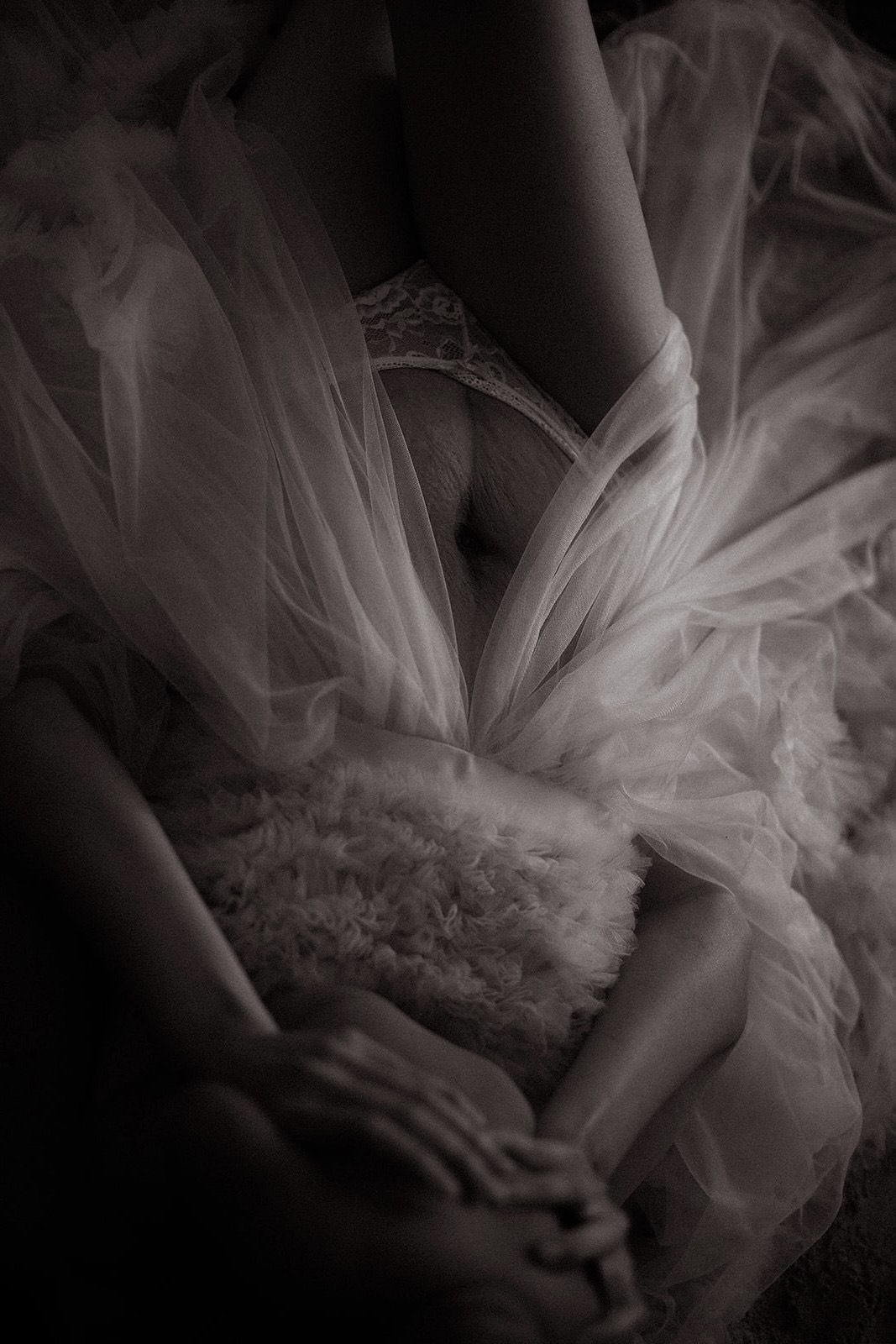 Intimate maternity detail enveloped in soft tulle