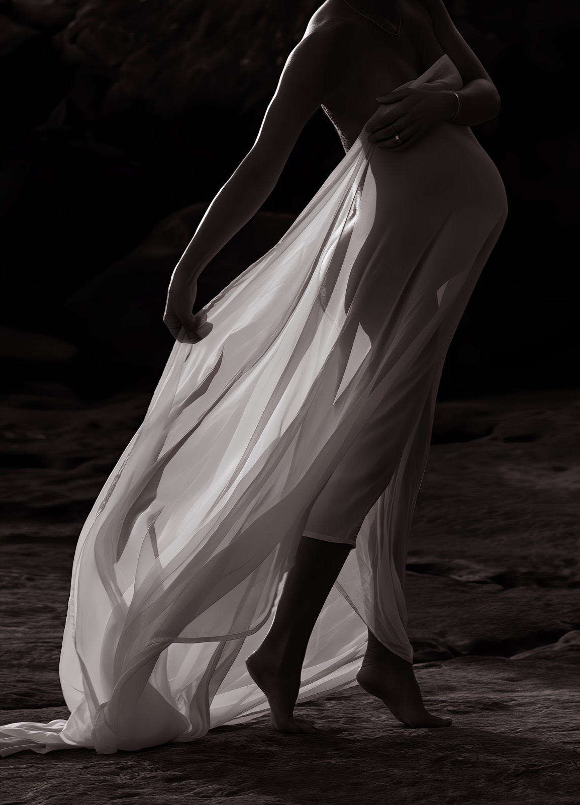 Close study of a pregnant figure walking in translucent white fabric